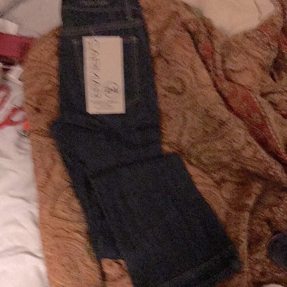 Carmar stretch dark denim size 24. Mid rise and bootcut.